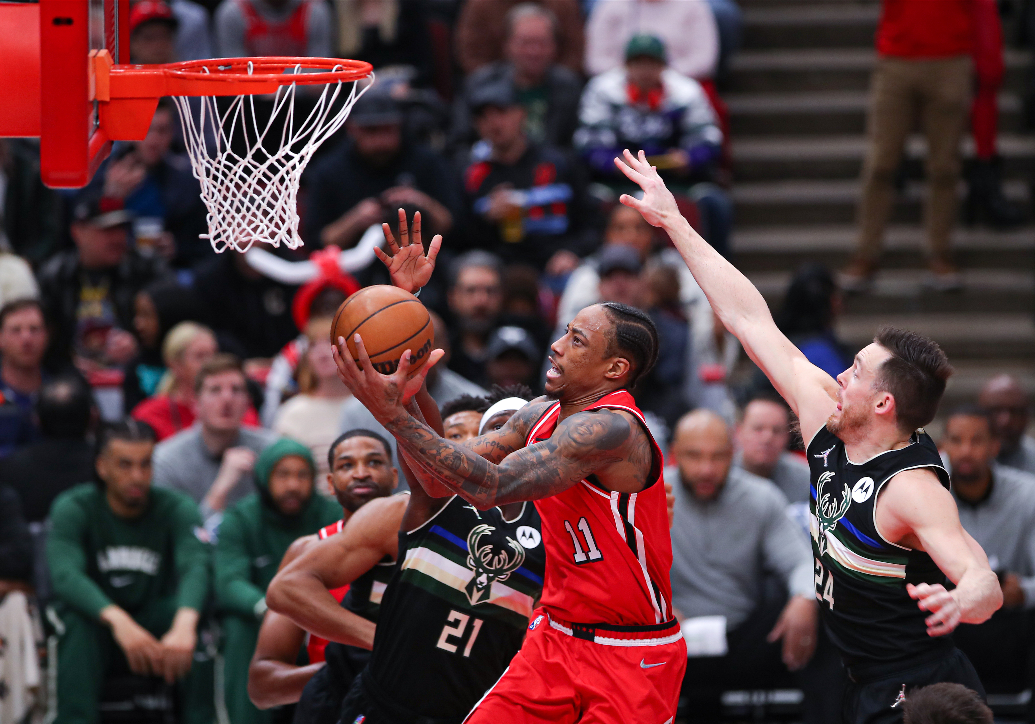 Chicago Bulls wing DeMar DeRozan shoots a layup during an NBA game against the Milwaukee Bucks during a game in April 2022