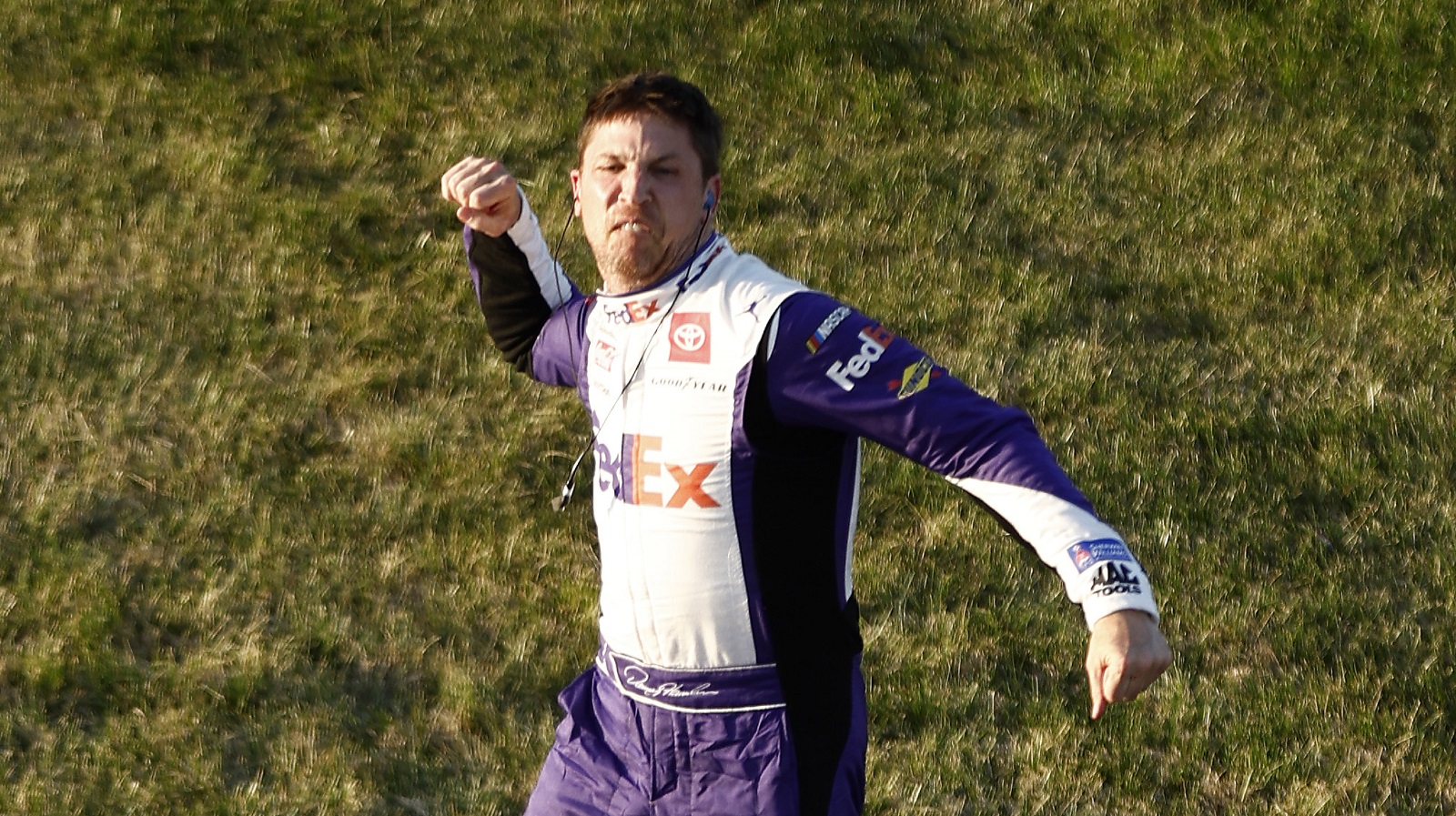 Denny Hamlin, driver of the No. 11 Toyota, celebrates after winning the NASCAR Cup Series Toyota Owners 400 at Richmond Raceway on April 3, 2022.