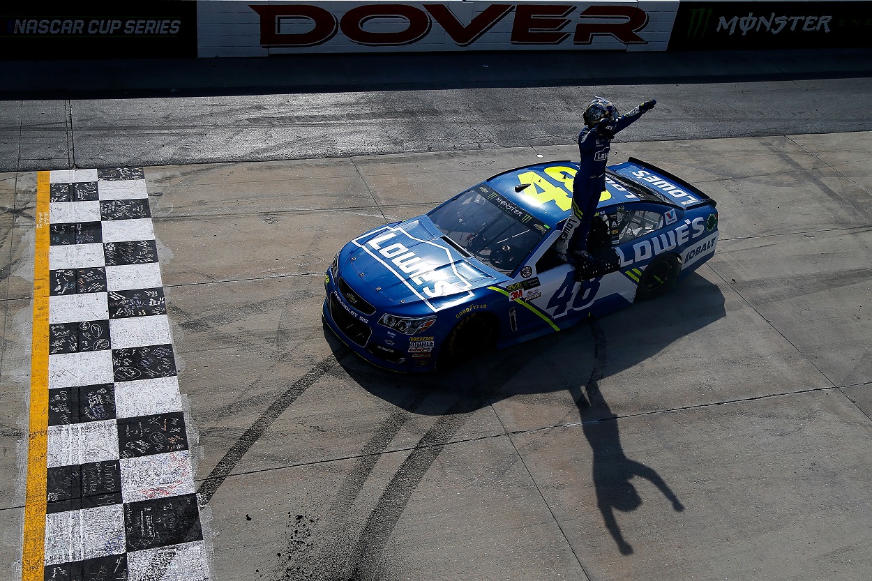 Jimmie Johnson celebrates after winning the 2017 NASCAR Cup Series AAA 400 Drive for Autism at Dover Motor Speedway