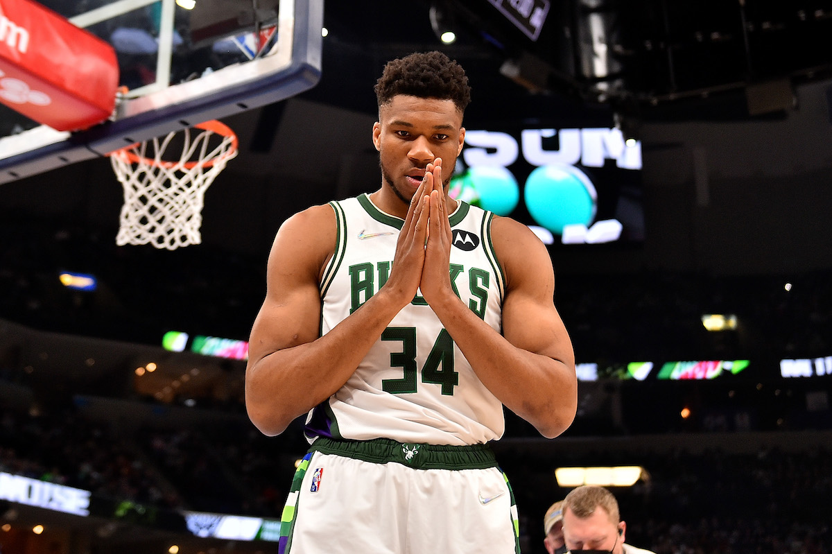 Giannis Antetokounmpo celebrates under the basket for the Milwaukee Bucks.