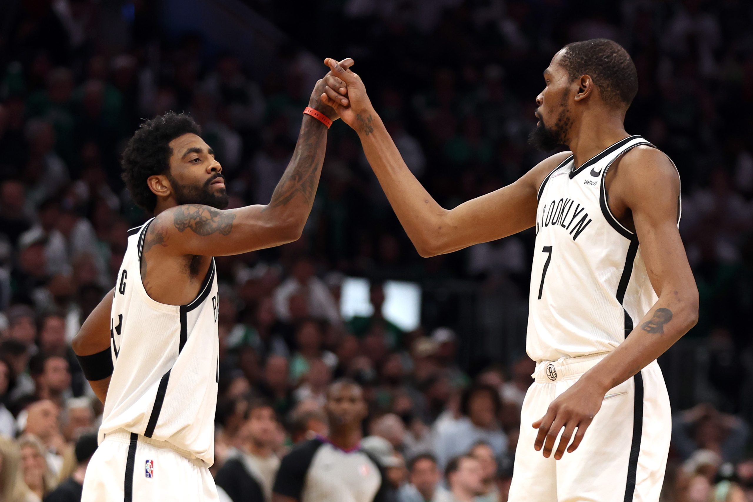 Kevin Durant, right, of the Brooklyn Nets and Kyrie Irving celebrate.