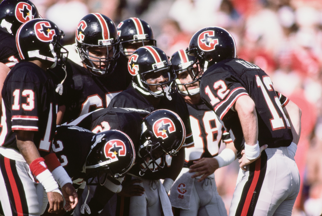 Jim Kelly, quarterback of the Houston Gamblers, talks to his offensive line during the USFL Western Conference game against the Los Angeles Express.