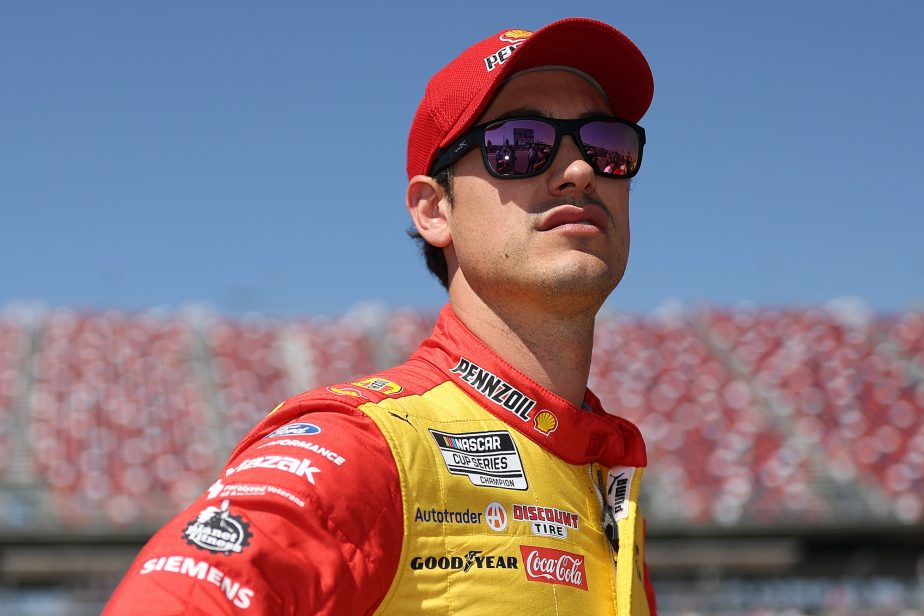 Joey Logano looks on before qualifying