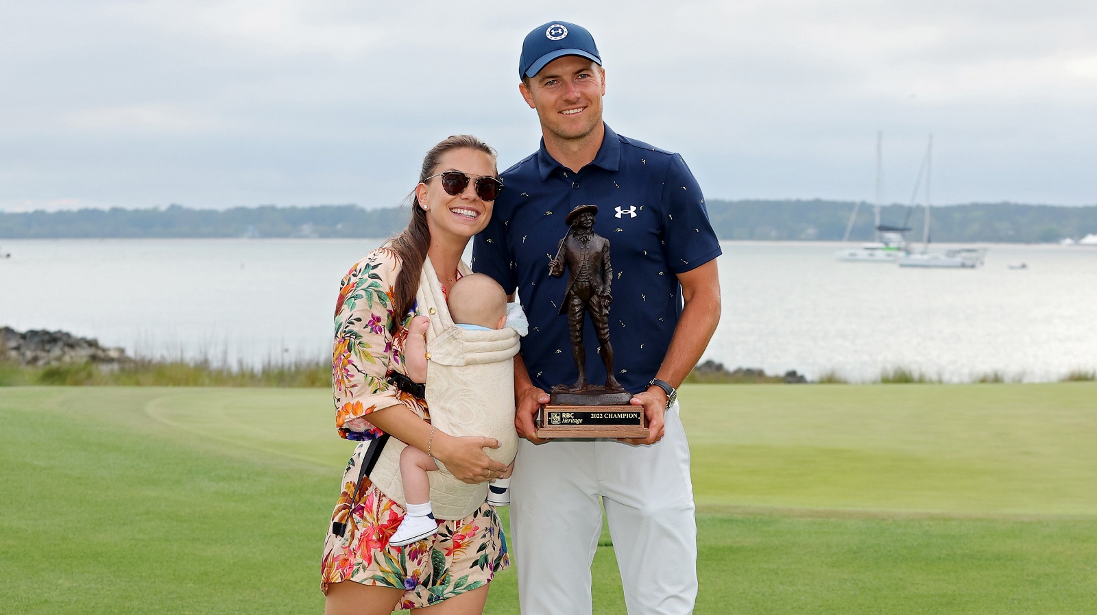 Jordan Spieth poses with the trophy with wife Annie Verret and son Sammy Spieth after winning the RBC Heritage on April 17, 2022, in Hilton Head Island, South Carolina. | Kevin C. Cox/Getty Images
