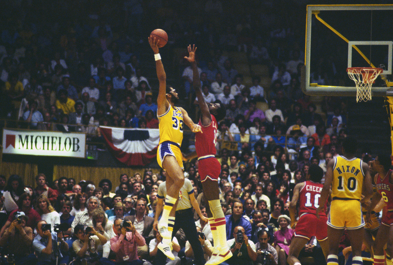 Kareem Abdul-Jabbar of the Los Angeles Lakers shoots over Caldwell Jones of the Philadelphia 76ers.