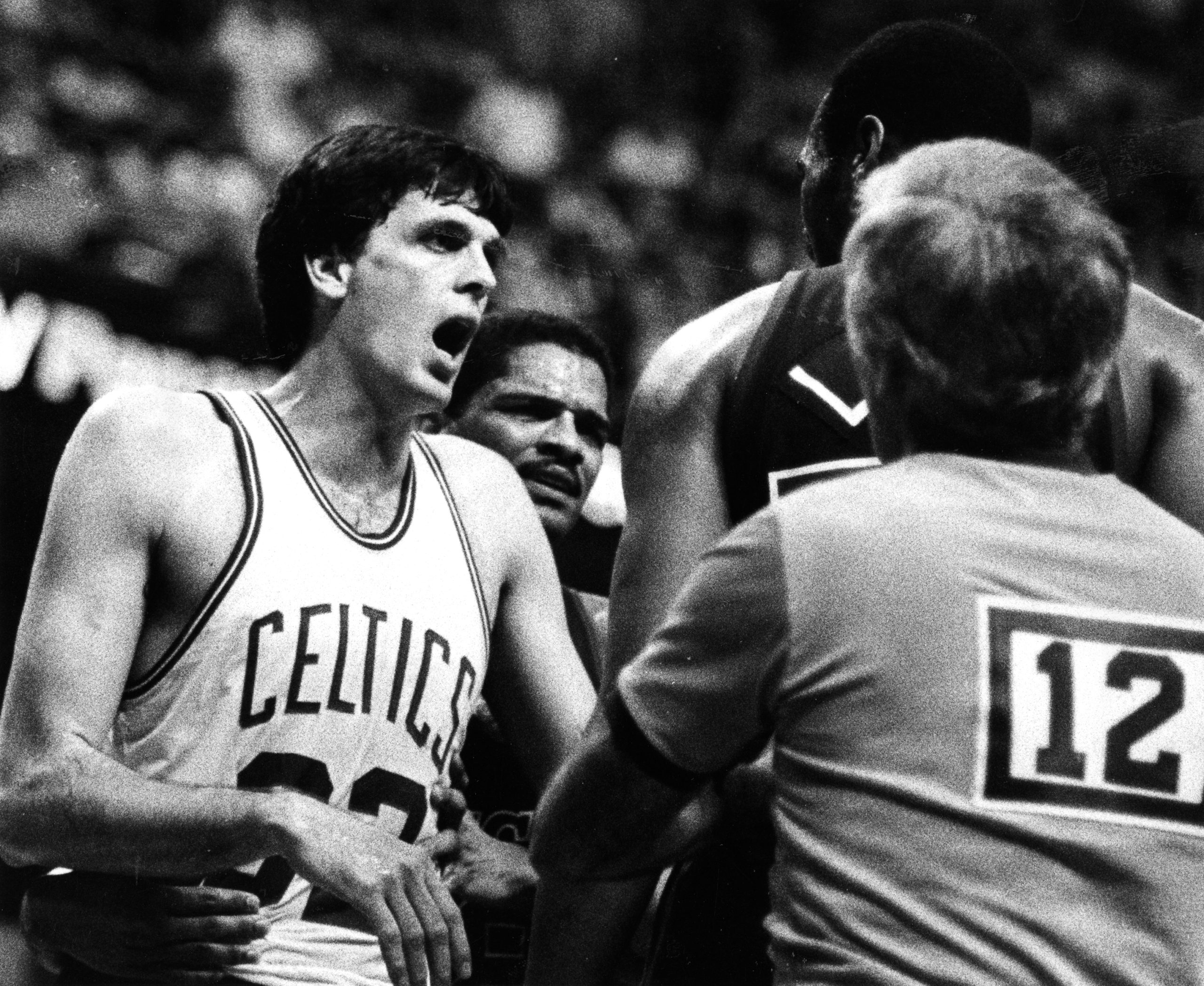 A referee moves to step in between Boston Celtics' Kevin McHale, left, and Milwaukee's Alton Lister.