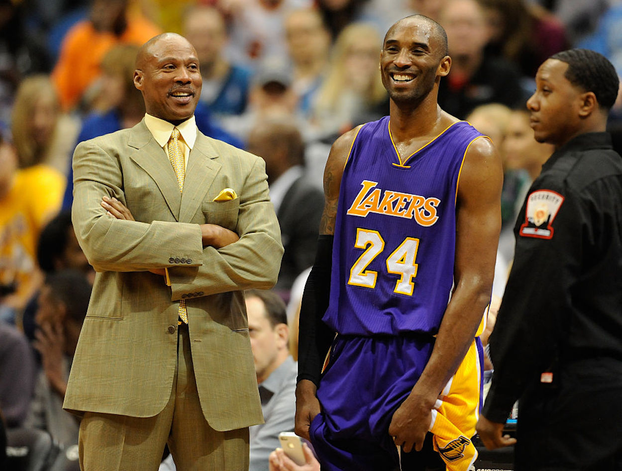 Kobe Bryant (R) and Byron Scott (L) stand together during a Lakers game.