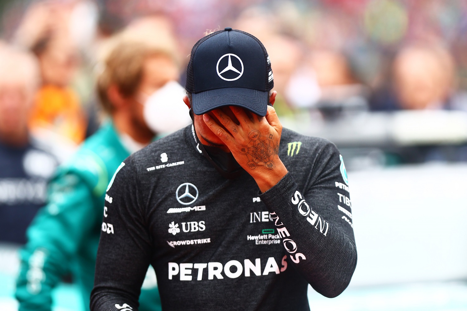 Lewis Hamilton of Great Britain and Mercedes wipes his face on the grid at the Formula 1 Grand Prix of Emilia Romagna at Autodromo Enzo e Dino Ferrari on April 24, 2022. | Dan Istitene - Formula 1/Formula 1 via Getty Images