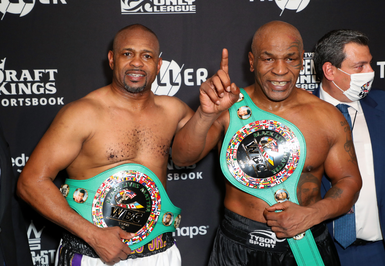 Roy Jones Jr. (L) and Mike Tyson celebrate their split draw.