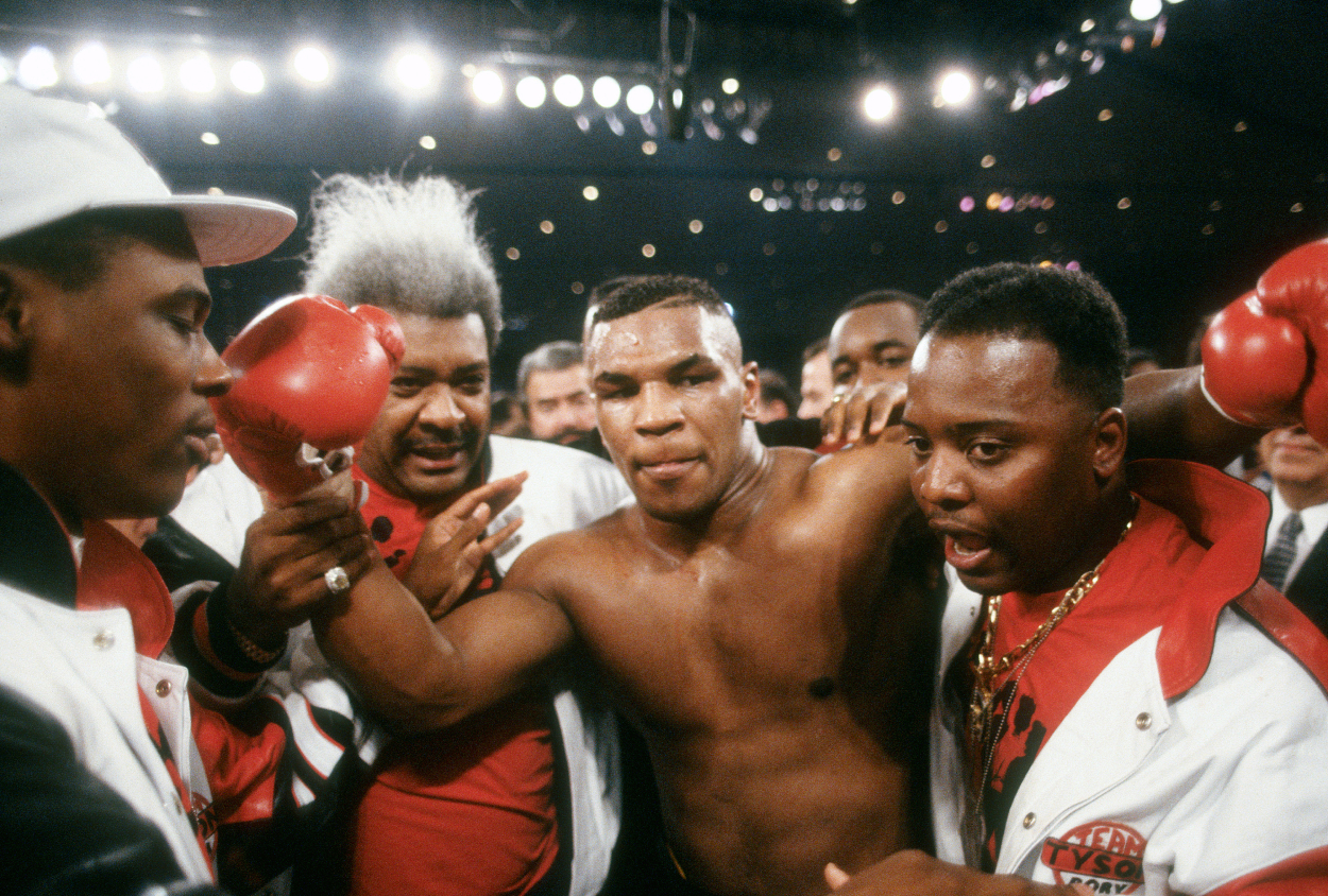 Mike Tyson celebrates after defeating James Tillis.