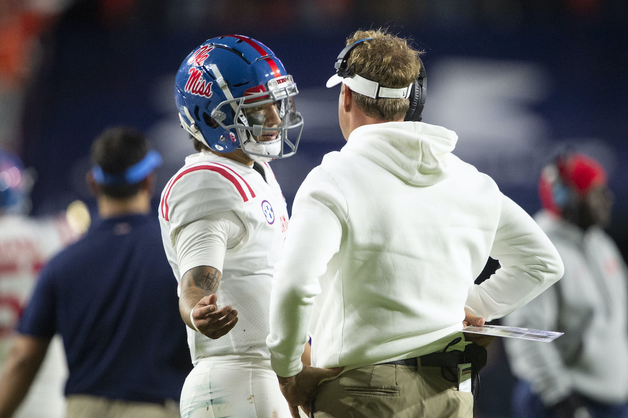 Ole Miss quarterback Matt Corral chats with head coach Lane Kiffin in 2021. Corral is now a top QB prospect in the 2022 NFL Draft.