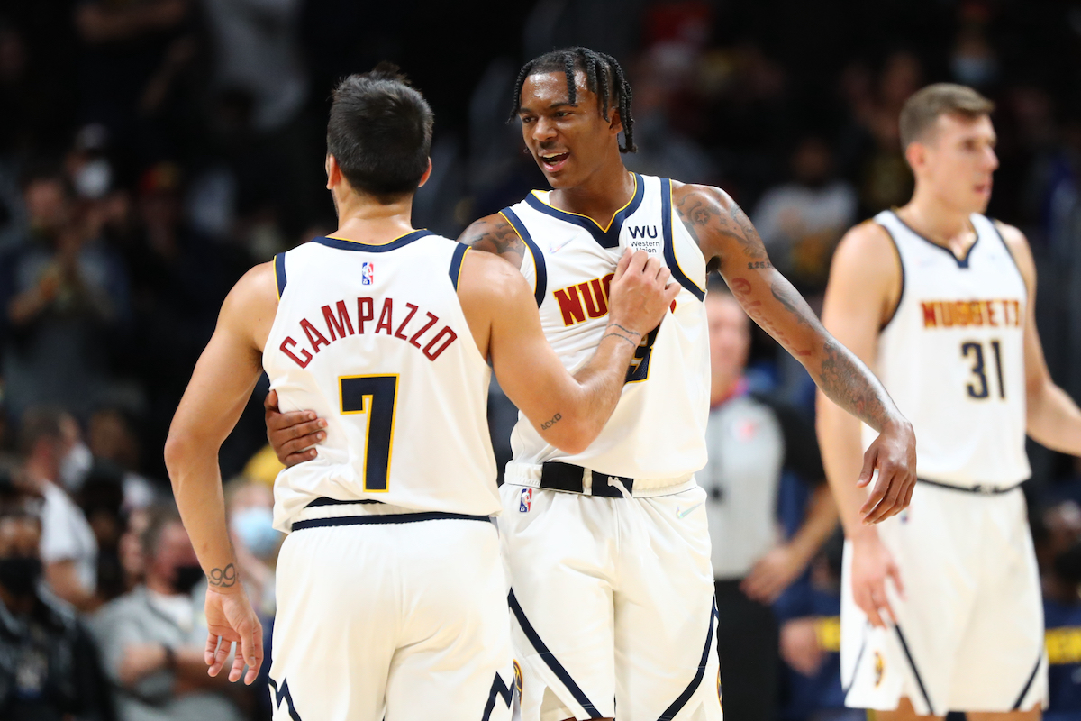Bones Hyland of the Denver Nuggets encourages teammate Facundo Campazzo against the Minnesota Timberwolves