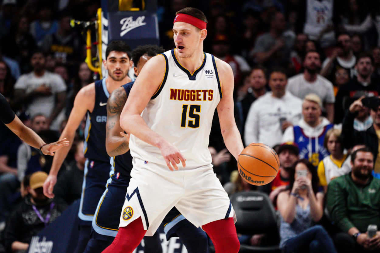 Nuggets big man Nikola Jokic backs an opponent down.