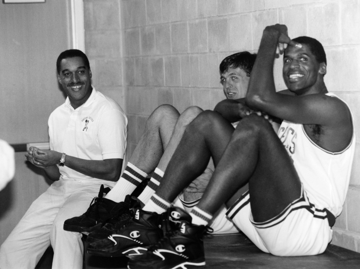 From left, Boston Celtics Dennis Johnson, Kevin McHale, and Robert Parish speak with one another.