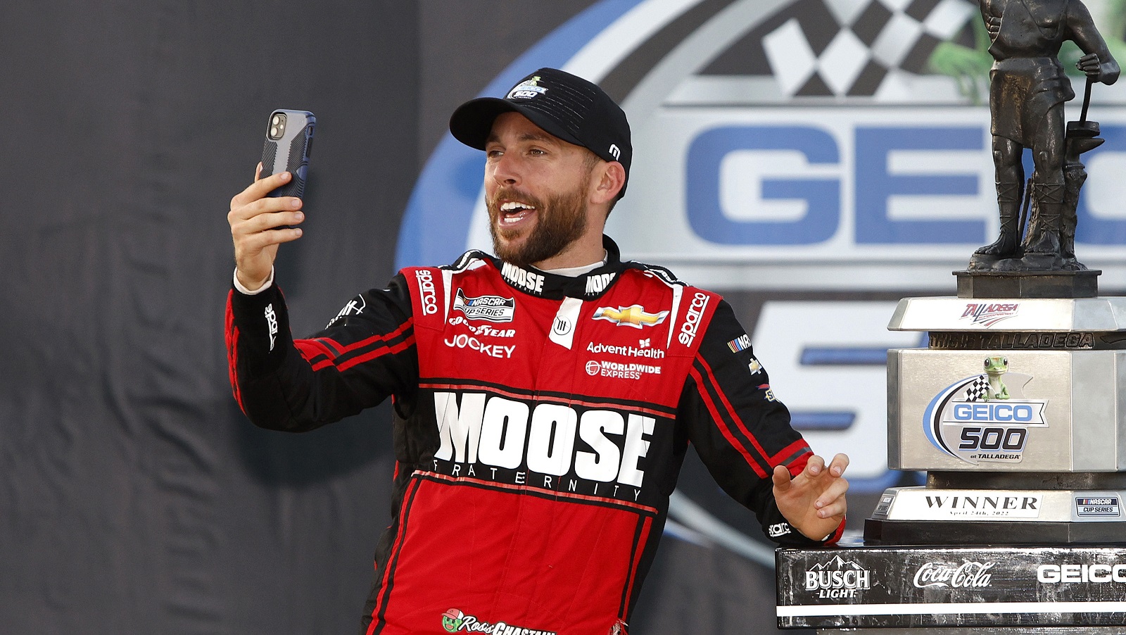 Ross Chastain, driver of the No. 1 Chevrolet, takes a selfie on Victory Lane after winning the NASCAR Cup Series GEICO 500 at Talladega Superspeedway on April 24, 2022.