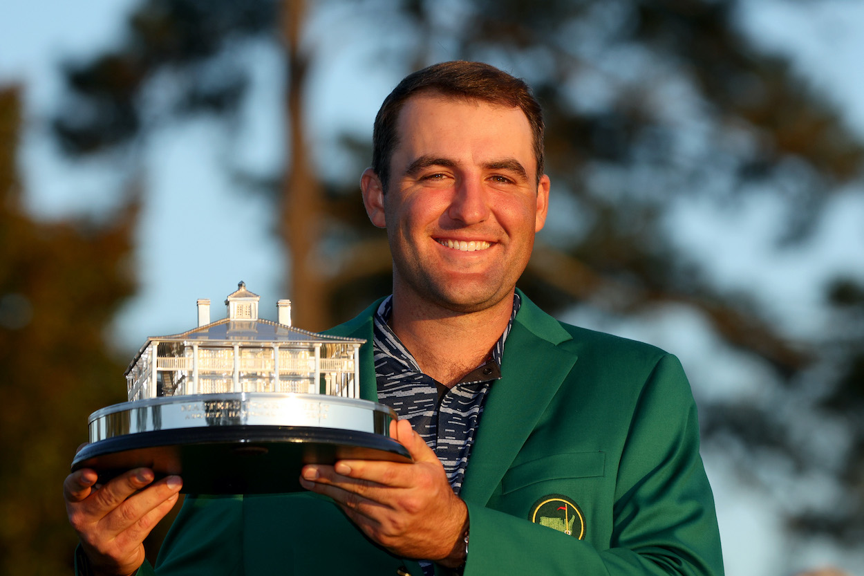 Scottie Scheffler poses with the Masters trophy.