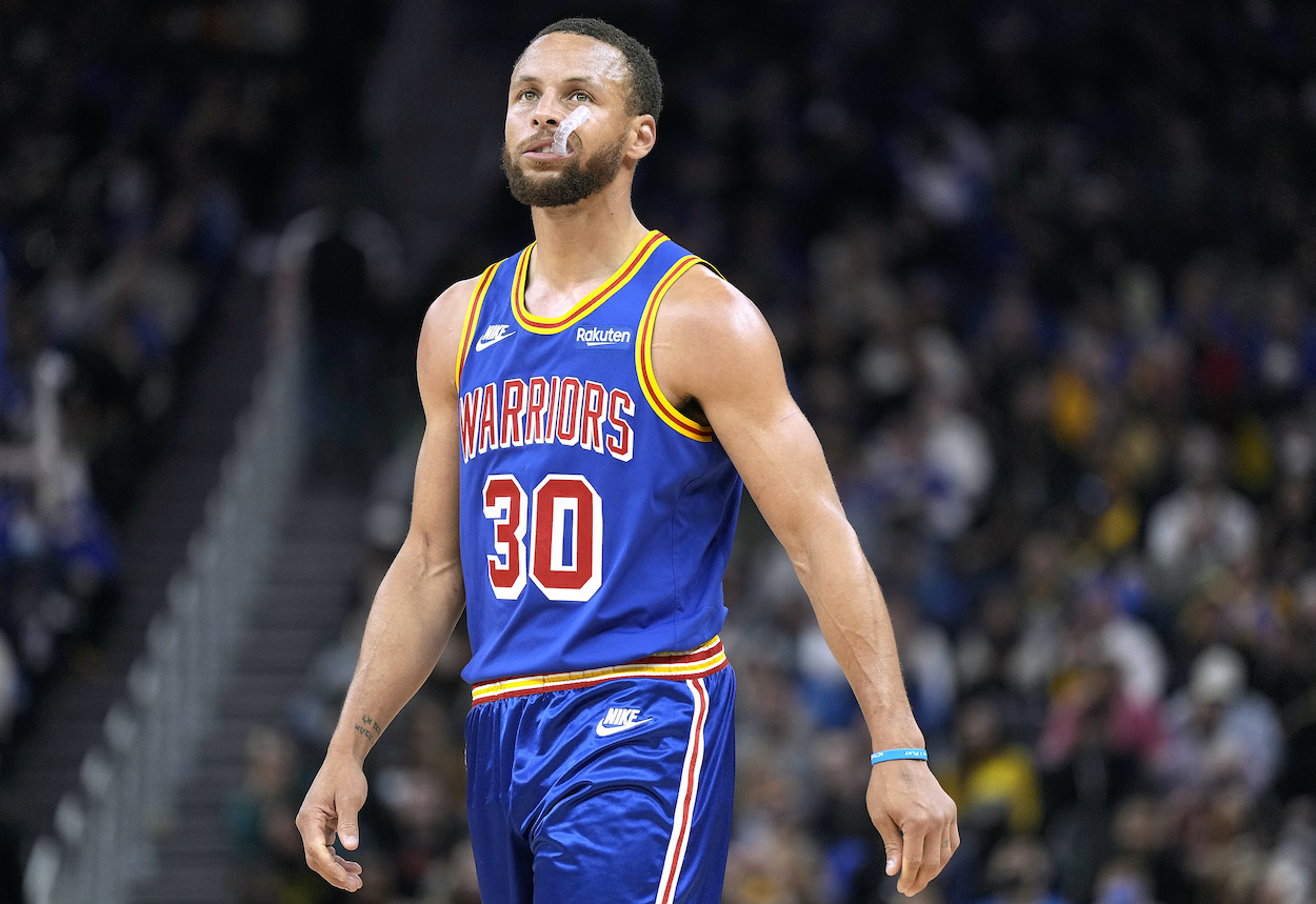 Stephen Curry looks on against the Bucks.