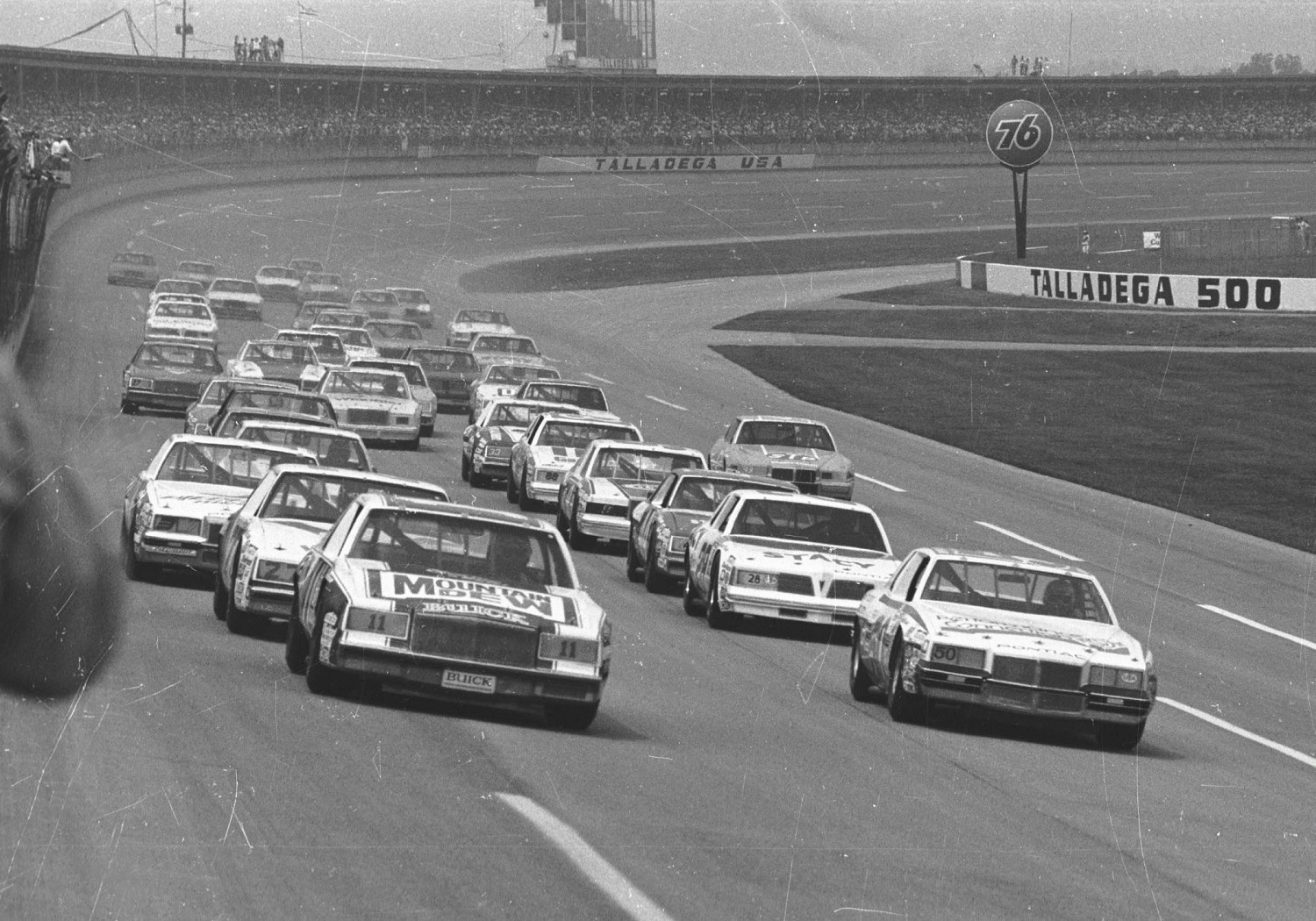 Geoff Bodine (No. 50) and Darrell Waltrip pace the field during one of the 1982 NASCAR races at the Talladega Speedway in Talladega, Alabama.
