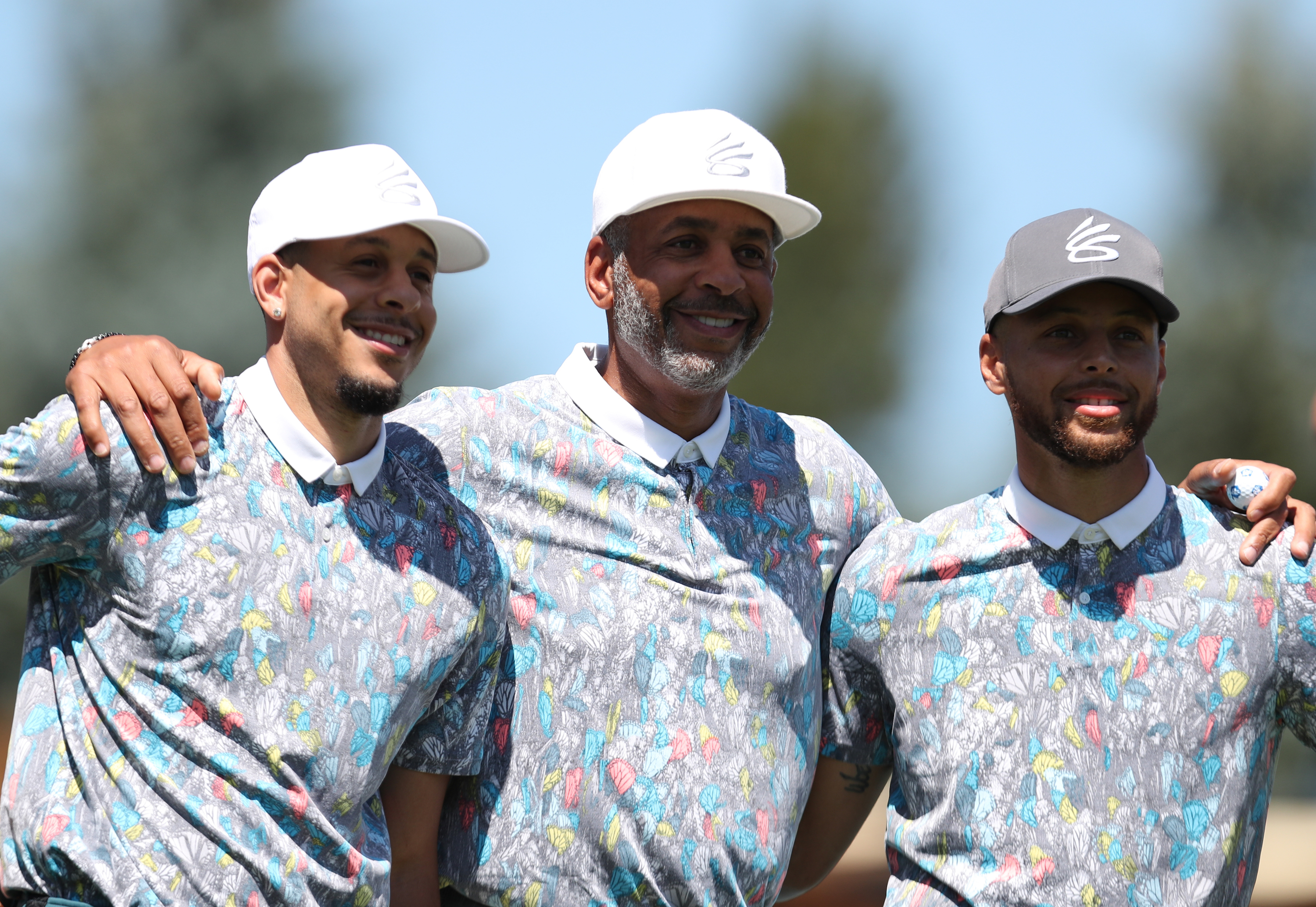 L-R: Seth Curry, Dell Curry, and Stephen Curry pose for a photo at the American Century Championship in July 2020