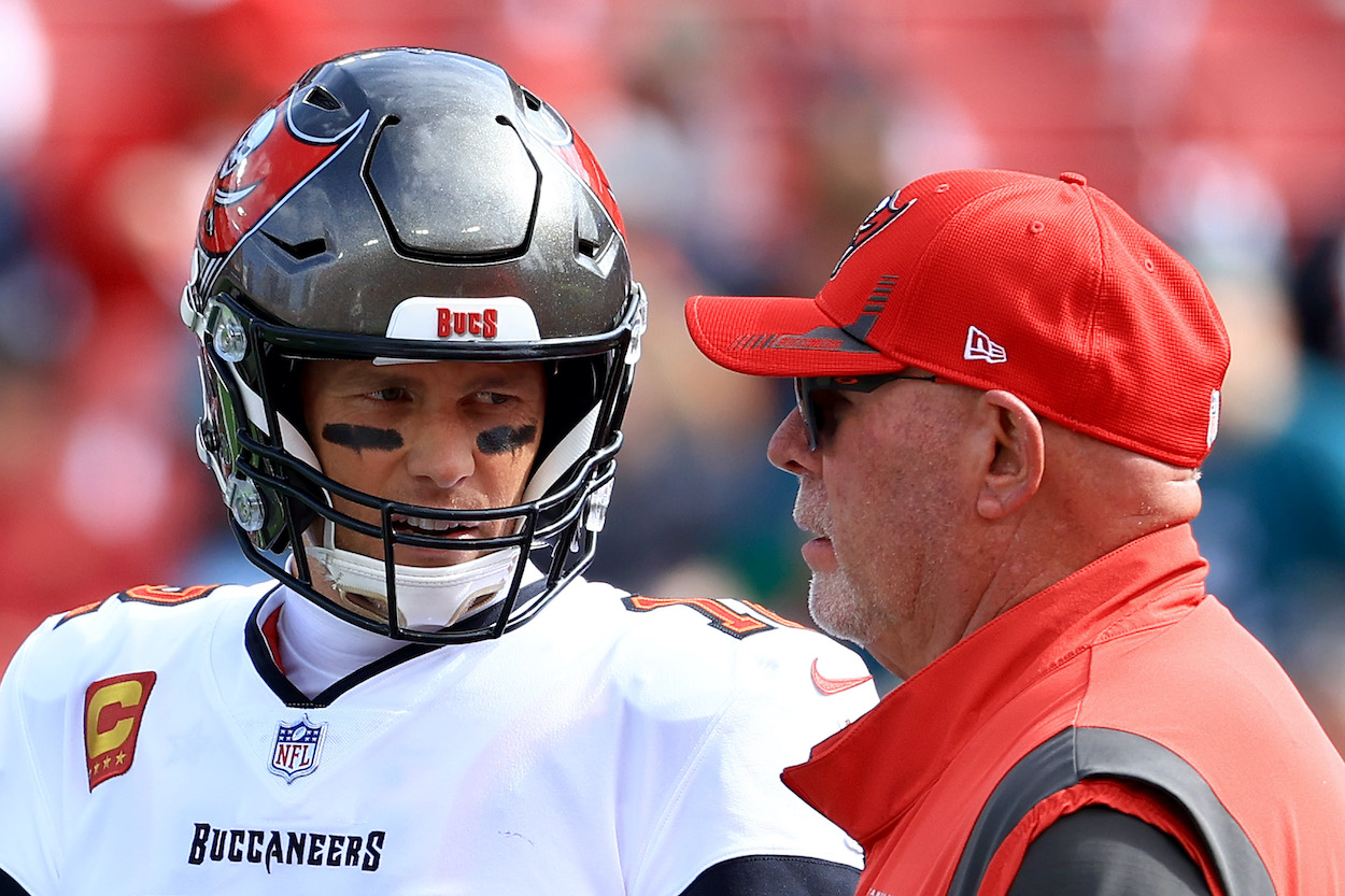 Tom Brady of the Tampa Bay Buccaneers talks with head coach Bruce Arians.