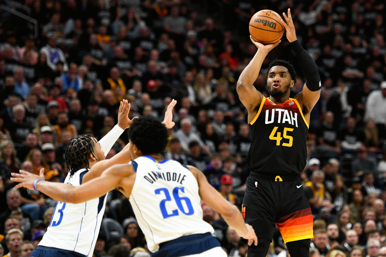 Donovan Mitchell of the Utah Jazz shoots over Jalen Brunson of the Dallas Mavericks.