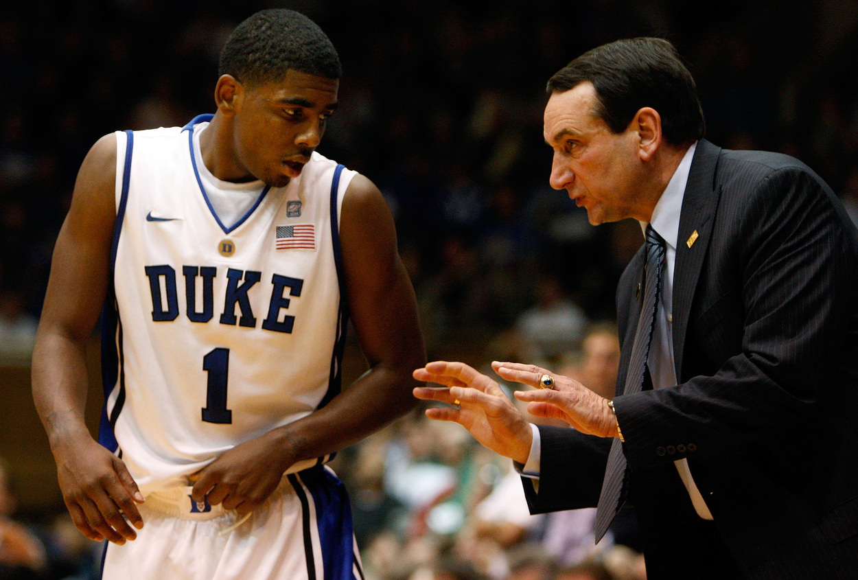 Duke point guard Kyrie Irving listens to Coach Mike Krzyzewski.