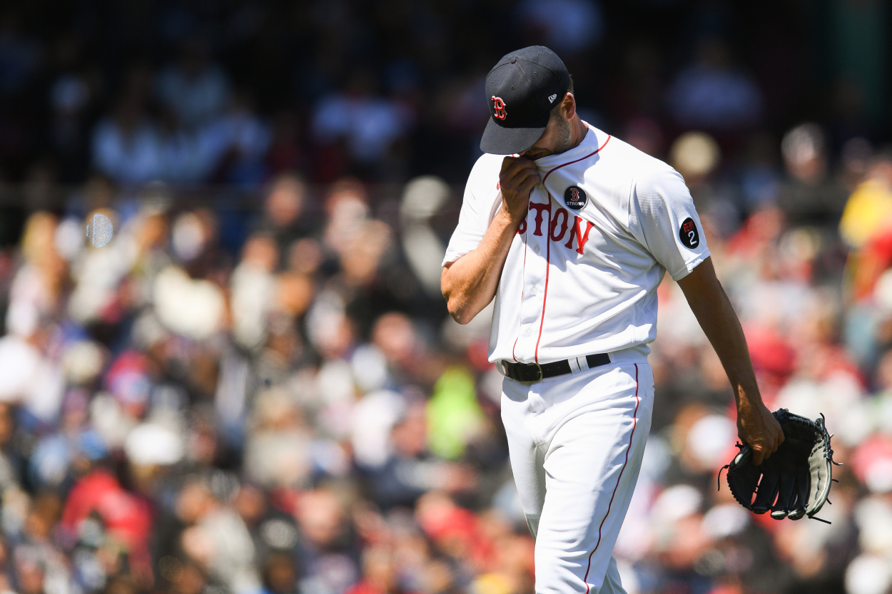 Rich Hill of the Boston Red Sox exits the game Monday against the Twins.