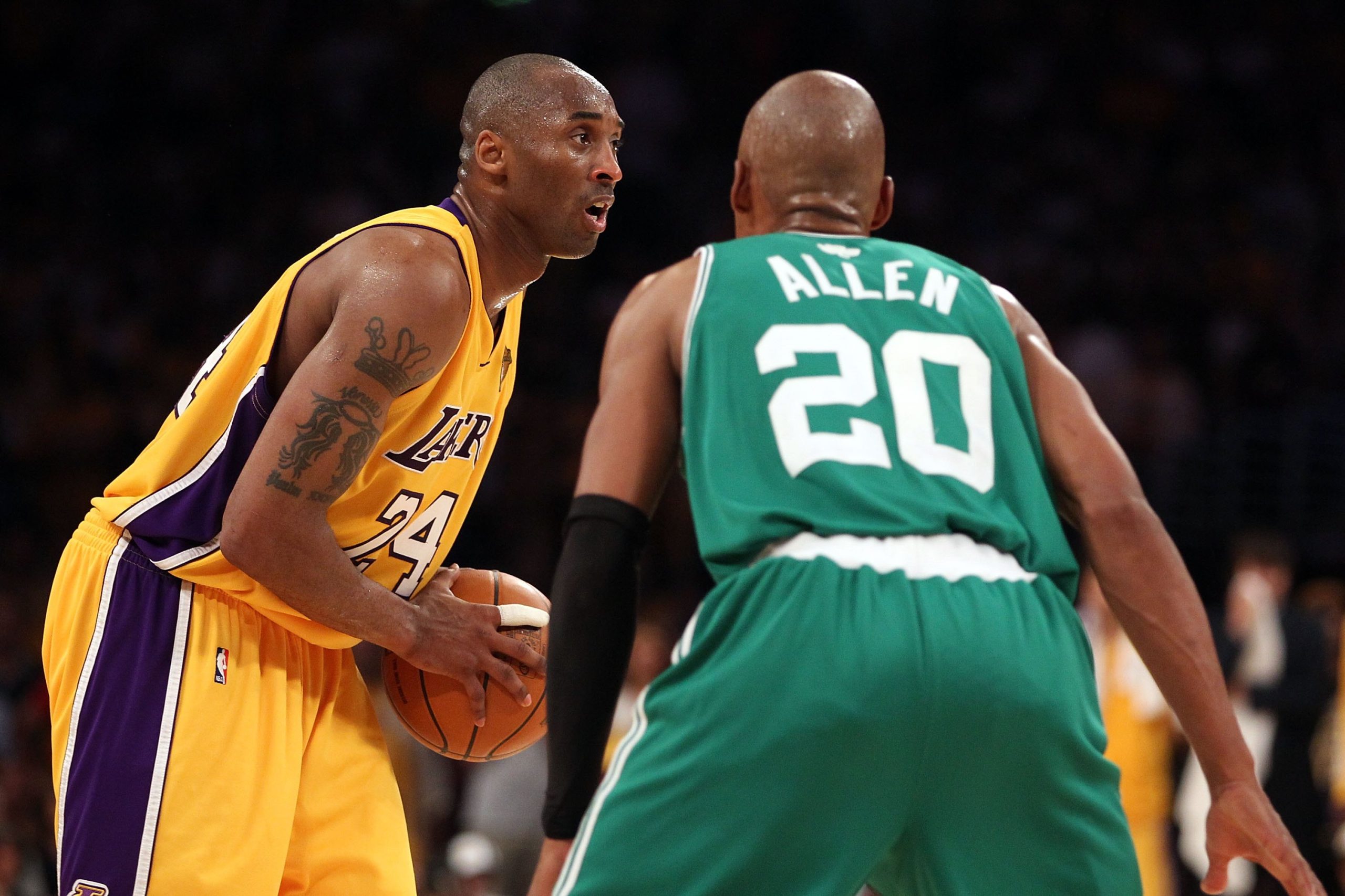 Kobe Bryant of the Los Angeles Lakers looks to drive on Ray Allen of the Boston Celtics.