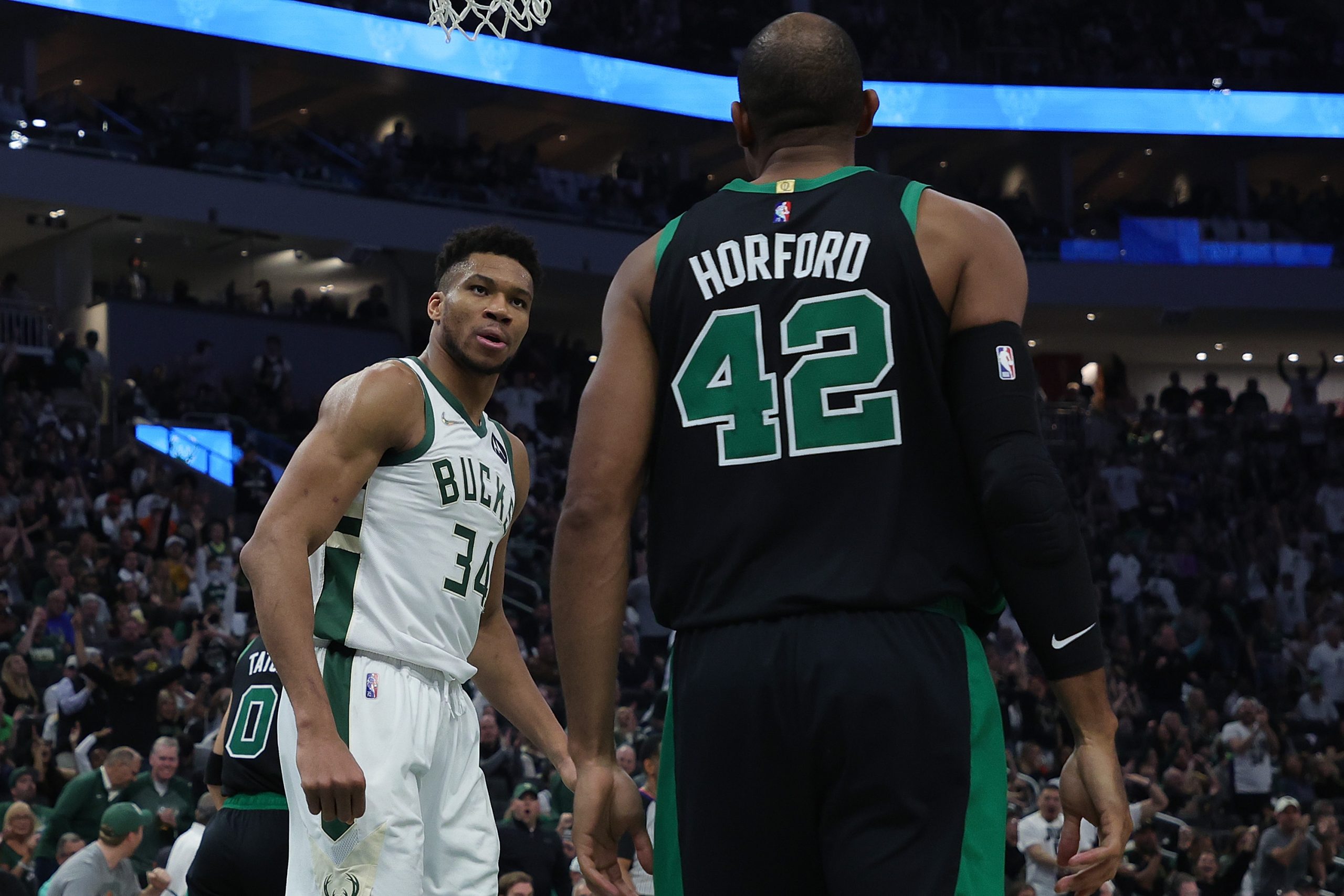 Giannis Antetokounmpo of the Milwaukee Bucks stares at Al Horford of the Boston Celtics.