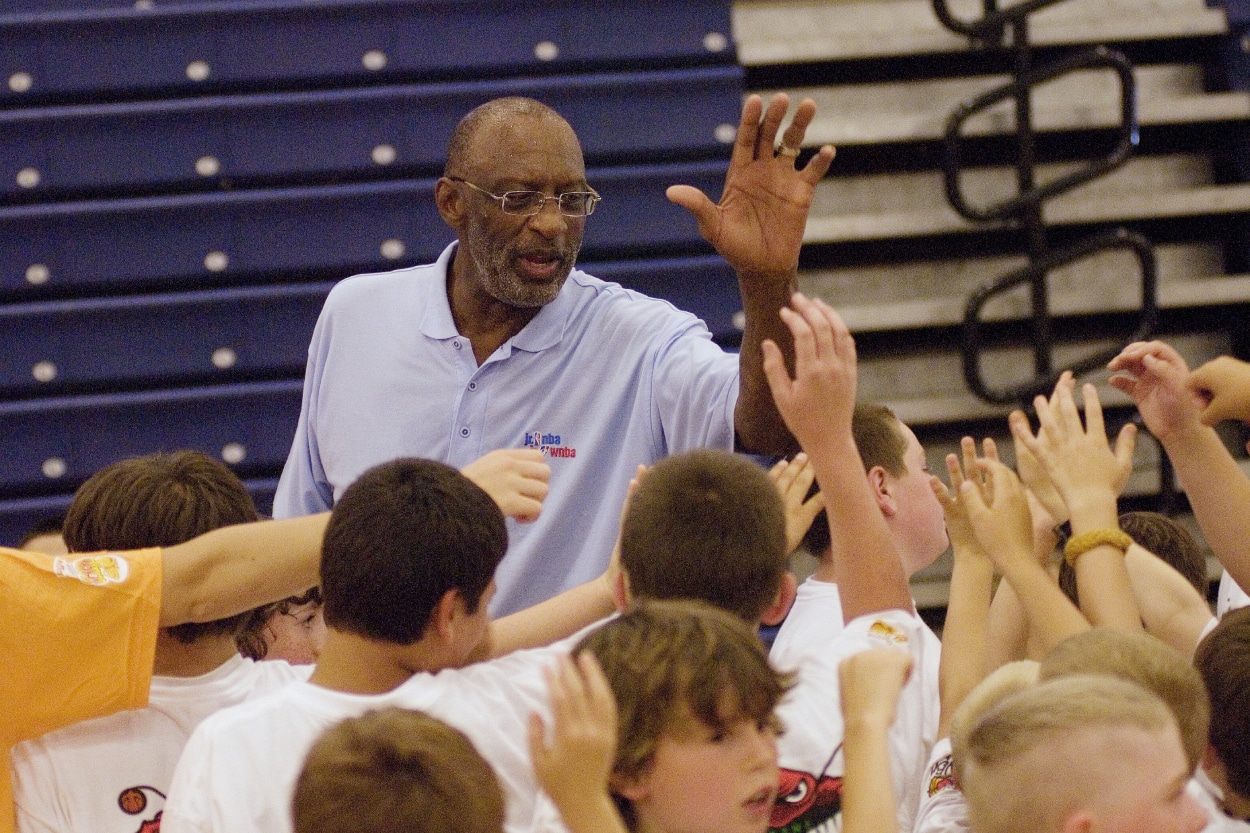 Basketball Hall of Famer Bob Lanier gives high fives to young players at the Jr. NBA/ Jr. WNBA Summer Camp.