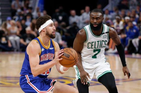 Klay Thompson of the Golden State Warriors pulls up to shoot the ball in the second quarter against Jaylen Brown of the Boston Celtics.