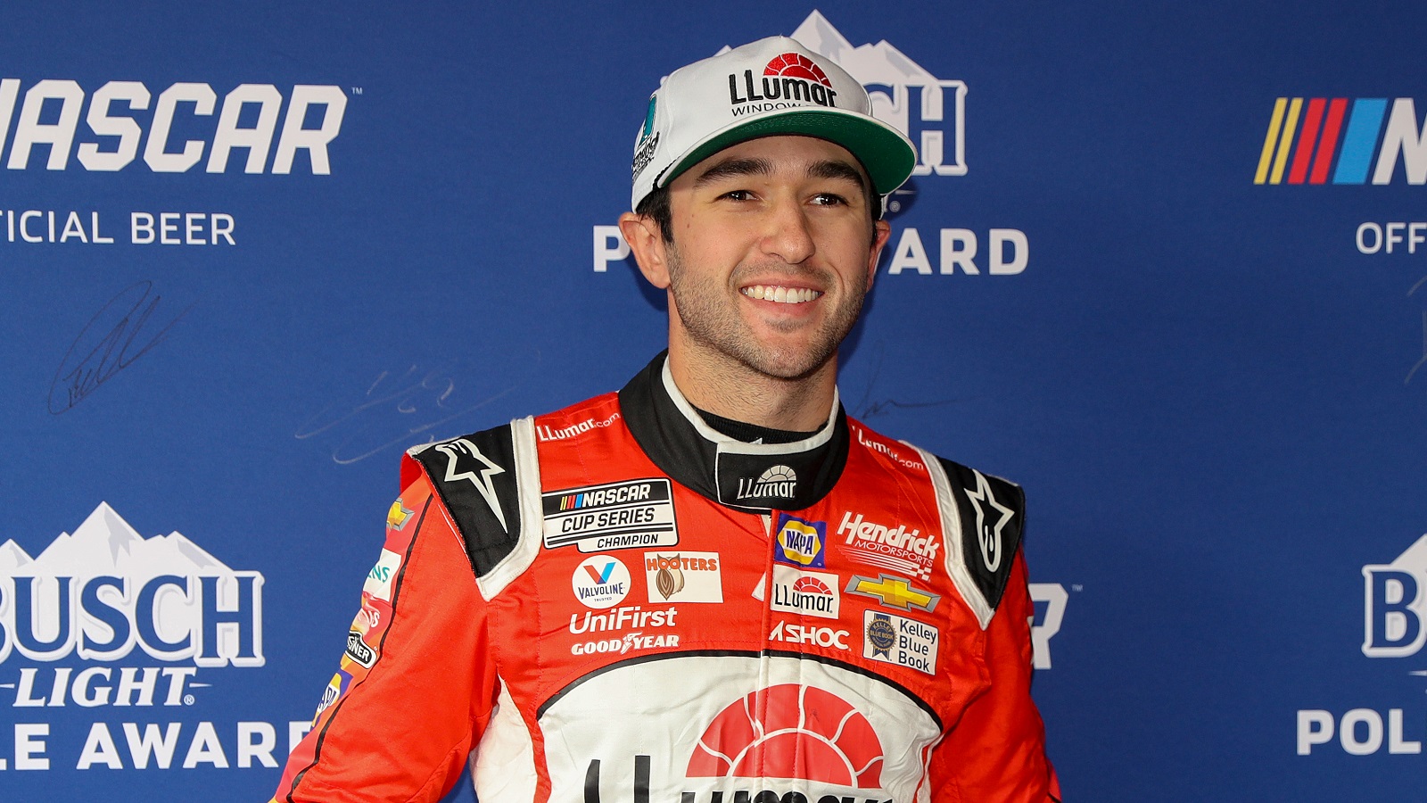 Chase Elliott poses for photos after winning the pole award during qualifying for the NASCAR Cup Series Blue-Emu Maximum Pain Relief 400 at Martinsville Speedway on April 8, 2022.