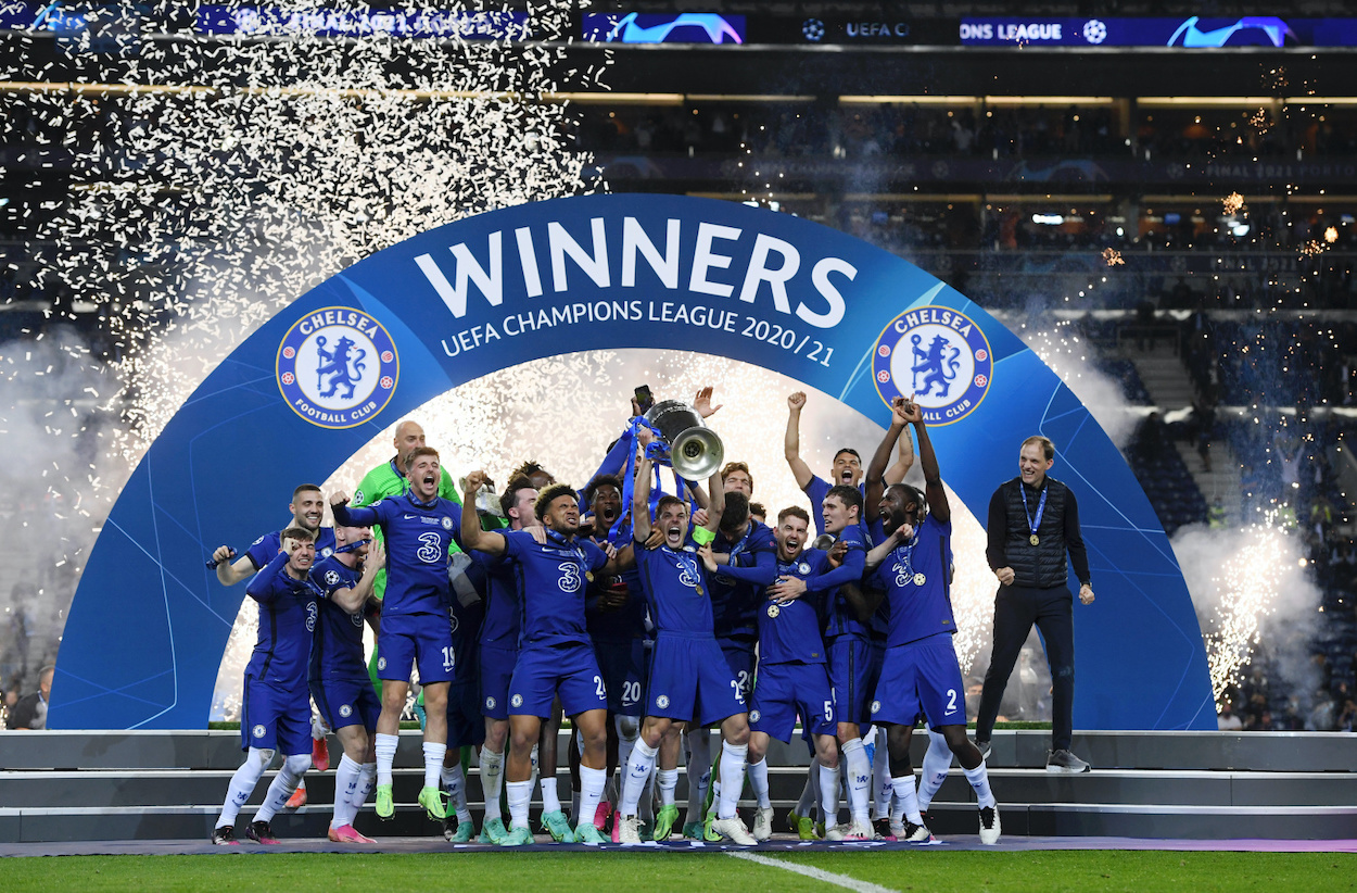Players of Chelsea celebrate with the trophy at the end of the UEFA Champions League final match against Manchester City at Dragao Stadium on May 29, 2021