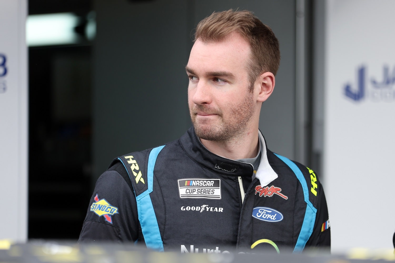 Cody Ware walks the garage area during practice for the NASCAR Cup Series Daytona 500 at Daytona International Speedway on Feb. 15, 2022.