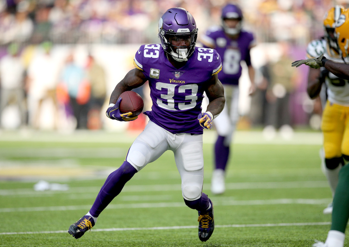 Dalvin Cook runs with the ball for the Minnesota Vikings