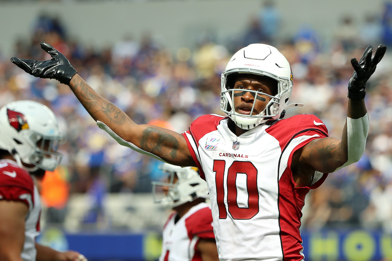 DeAndre Hopkins of the Arizona Cardinals reacts after a touchdown. The WR will serve a six-game PED suspension in 2022.