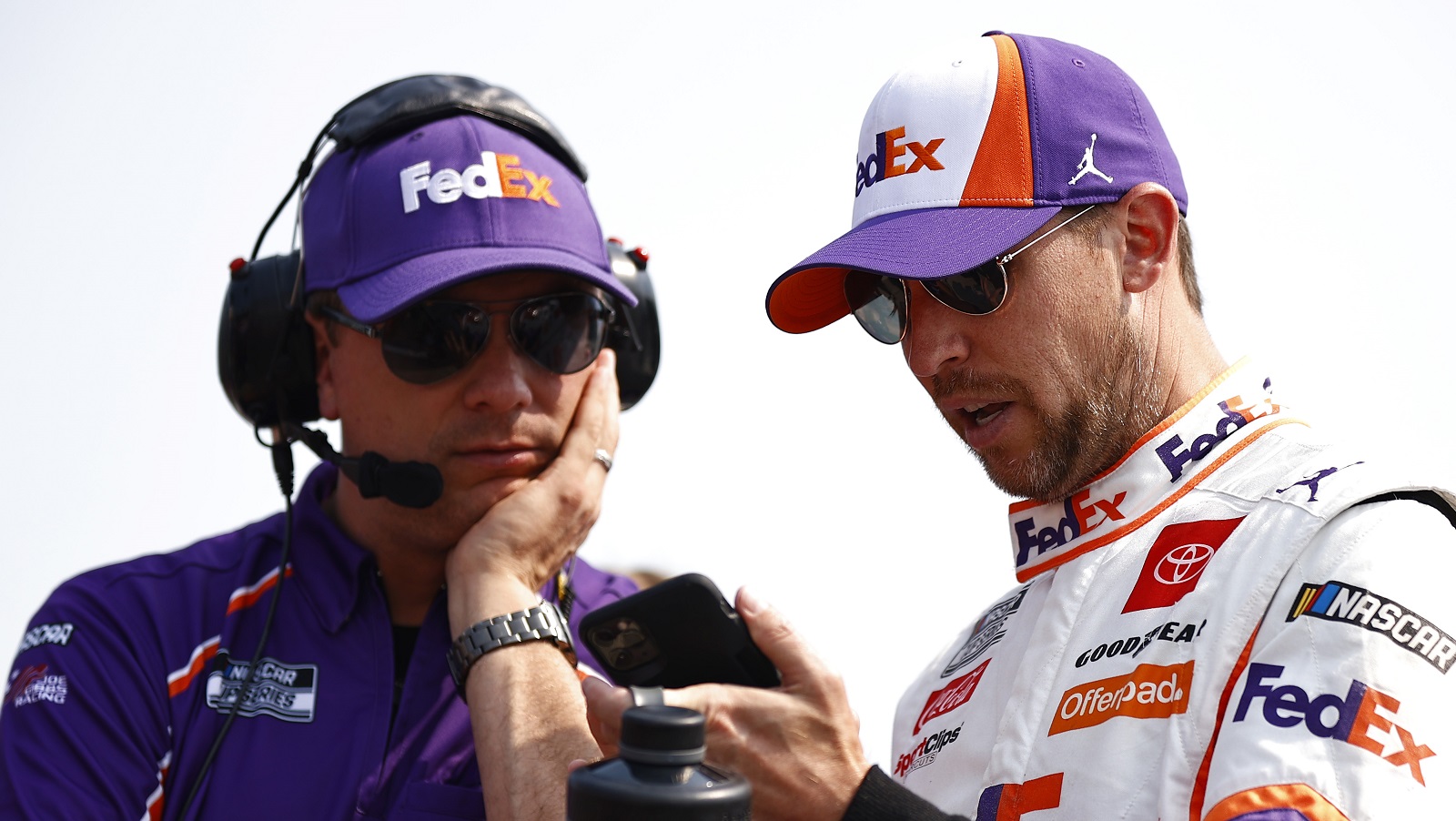 Denny Hamlin and crew chief Chris Gabehart talk on the grid during qualifying for the NASCAR Cup Series Jockey Made in America 250 at Road America on July 4, 2021.