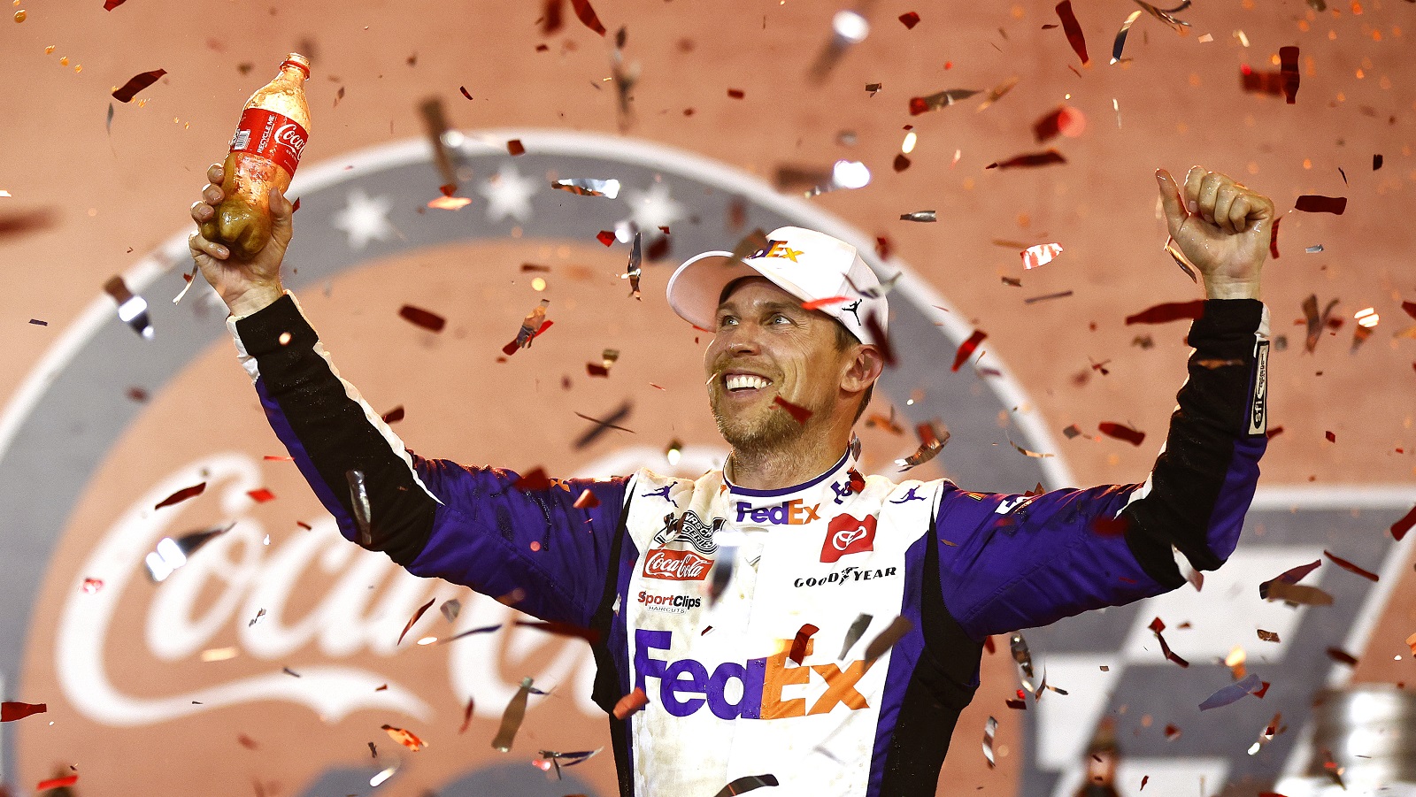 Denny Hamlin, driver of the No. 11 Toyota, celebrates after winning the NASCAR Cup Series Coca-Cola 600 at Charlotte Motor Speedway on May 29, 2022.