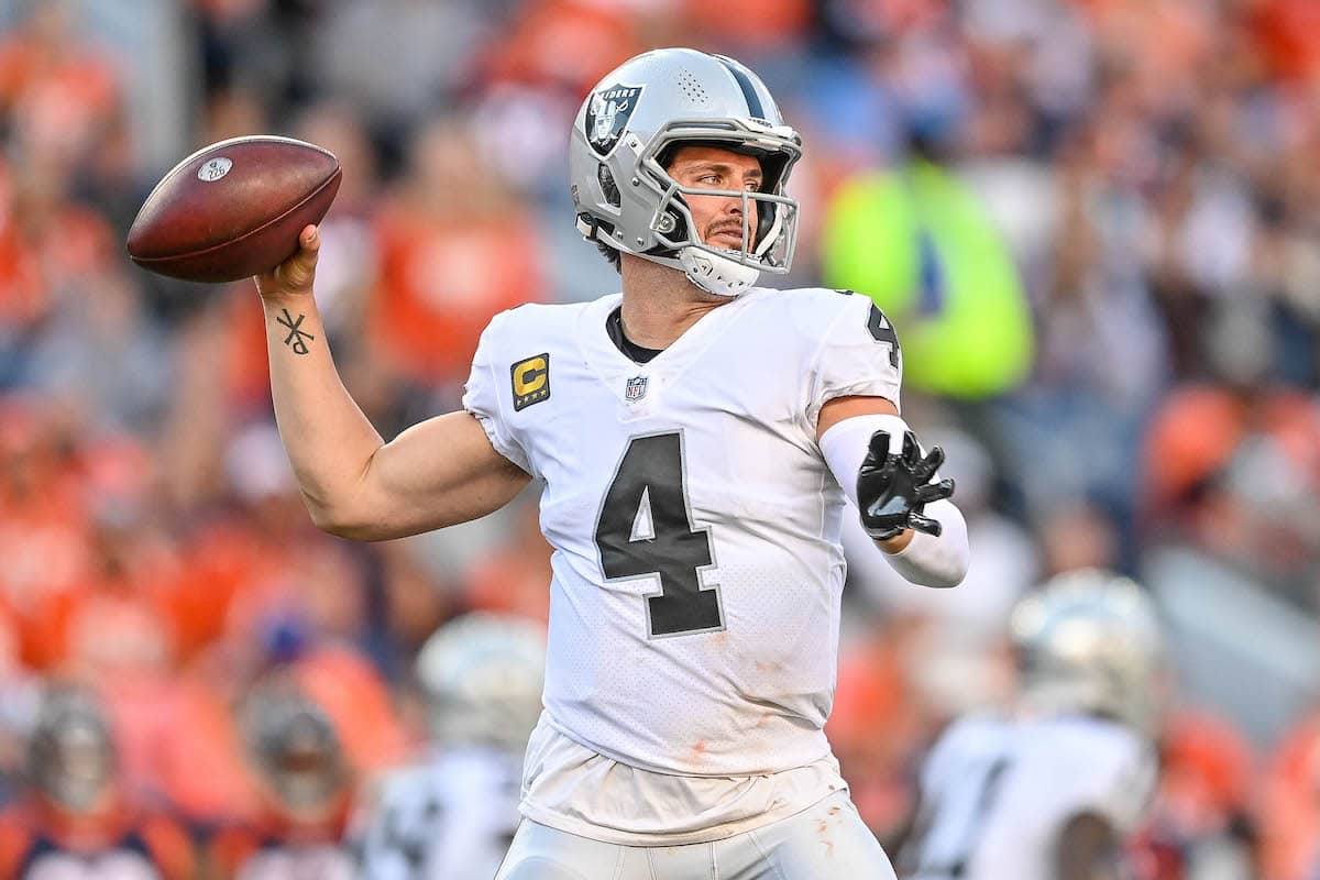 Derek Carr prepares to throw a pass