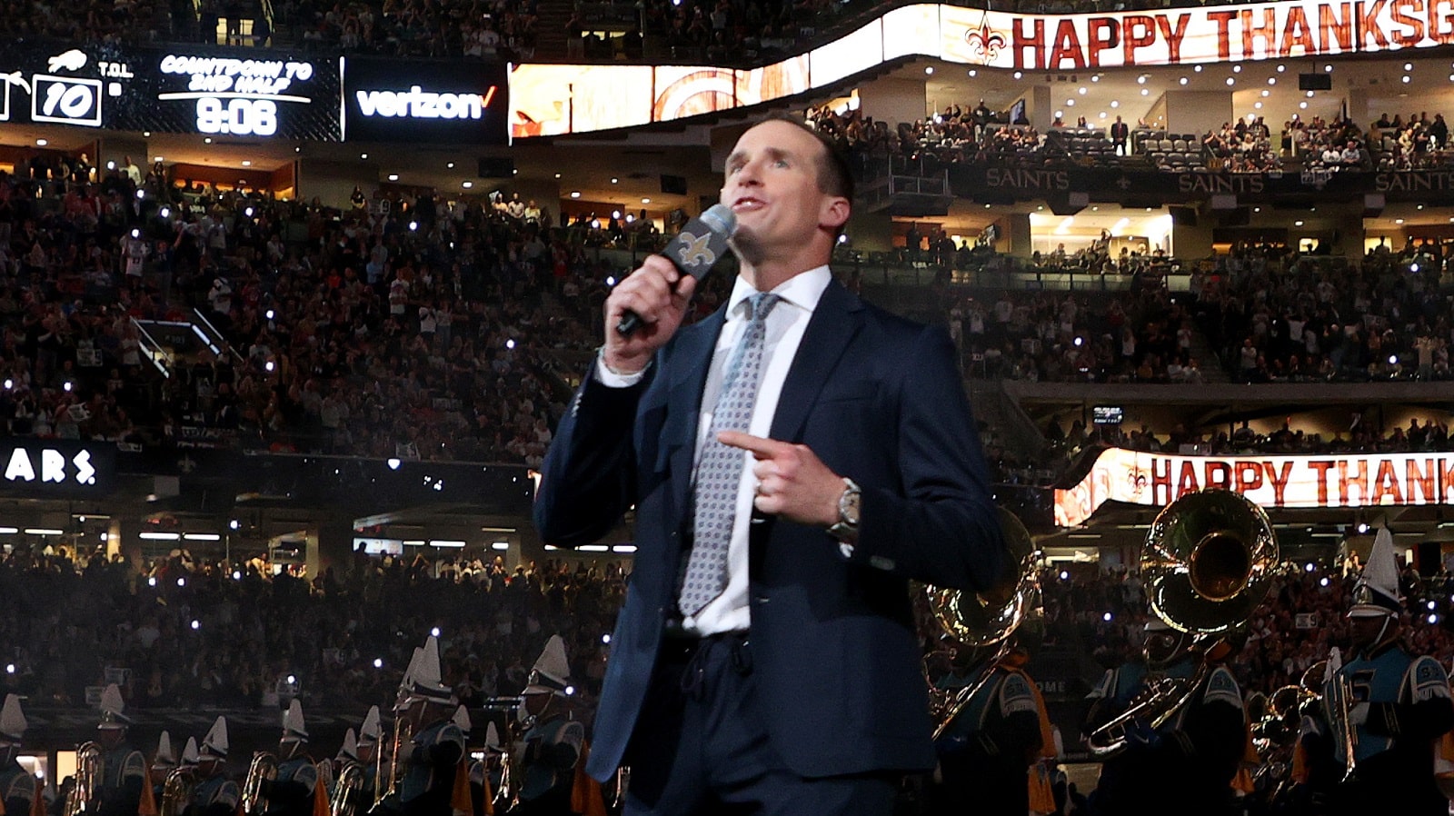 Former New Orleans Saints quarterback Drew Brees speaks to fans during halftime of the game between the Buffalo Bills and the New Orleans Saints on Nov. 25, 2021.