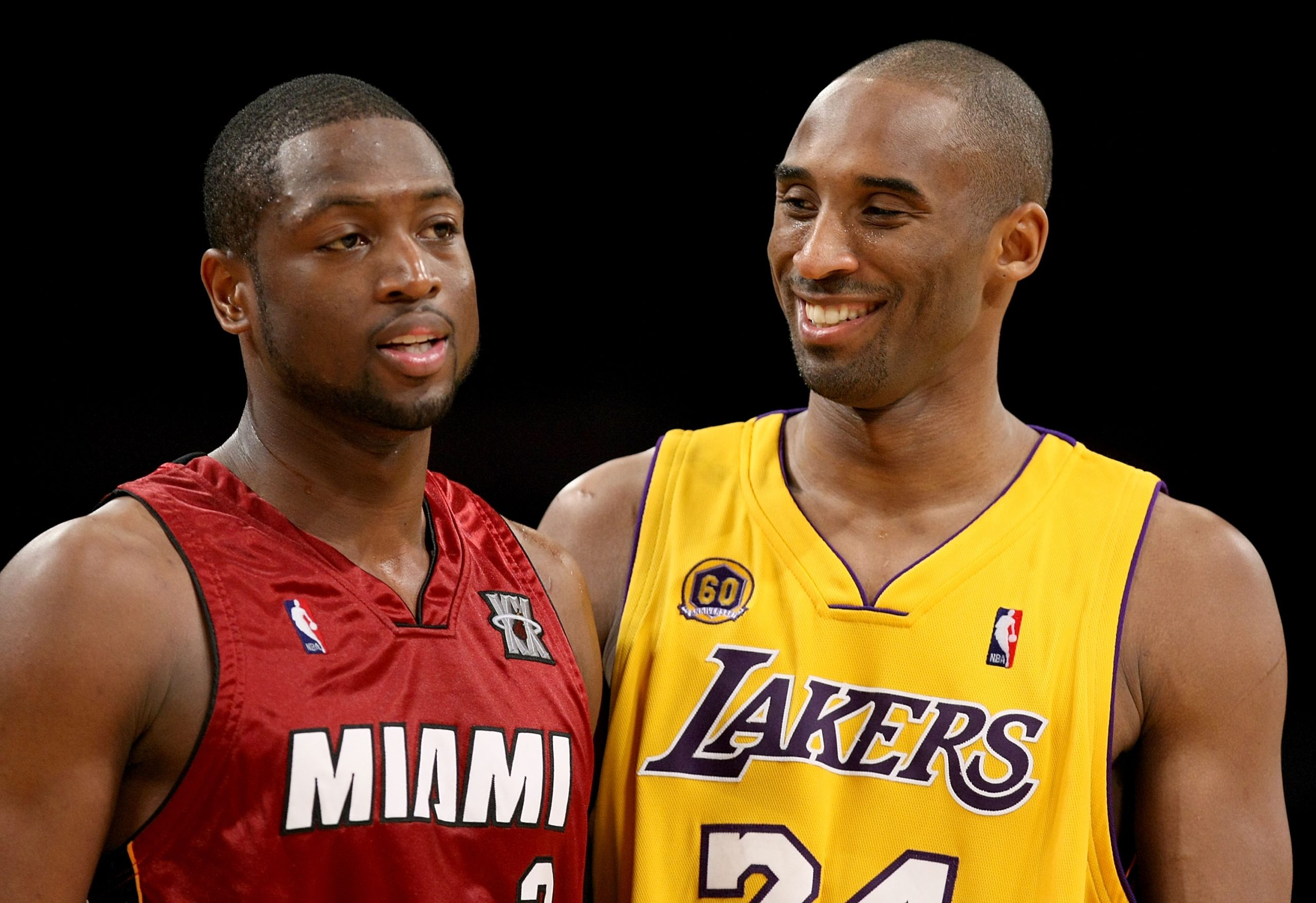 Dwyane Wade of the Miami Heat, left, and Kobe Bryant of the Los Angeles Lakers talk during a break.
