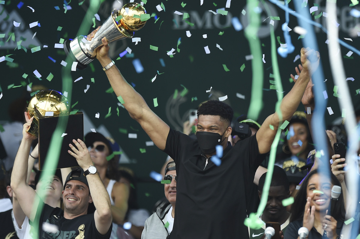 Giannis Antetokounmpo celebrates with the Larry O'Brien trophy during the Milwaukee Bucks 2021 NBA Championship Victory Parade