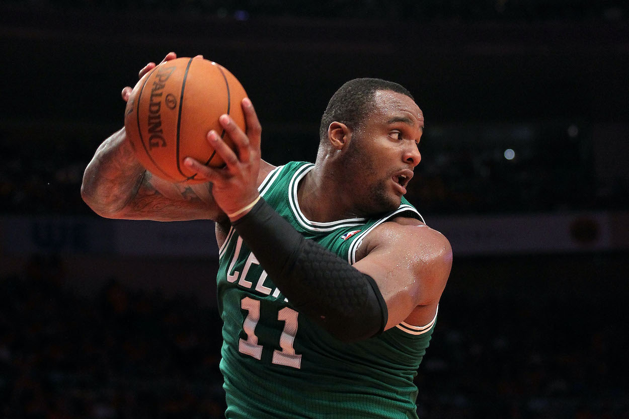 Glen Davis pulls down a rebound for the Celtics.