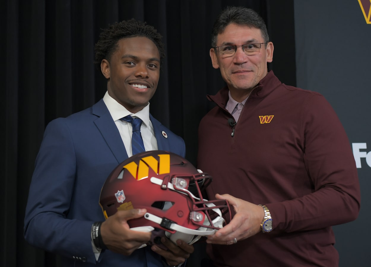 Washington Commanders first round draft pick Jahan Dotson, left, poses with head coach Ron Rivera. Dotson recently graduated from college.