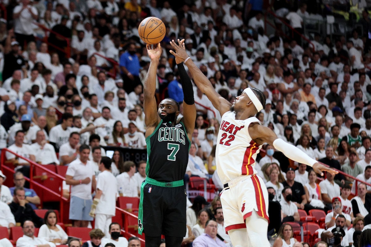 Jaylen Brown shoots over the outstretched arm of Jimmy Butler