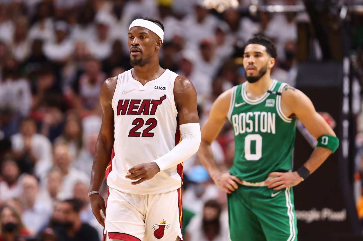 Jimmy Butler of the Miami Heat and Jayson Tatum of the Boston Celtics look on during the fourth quarter of Game 1.