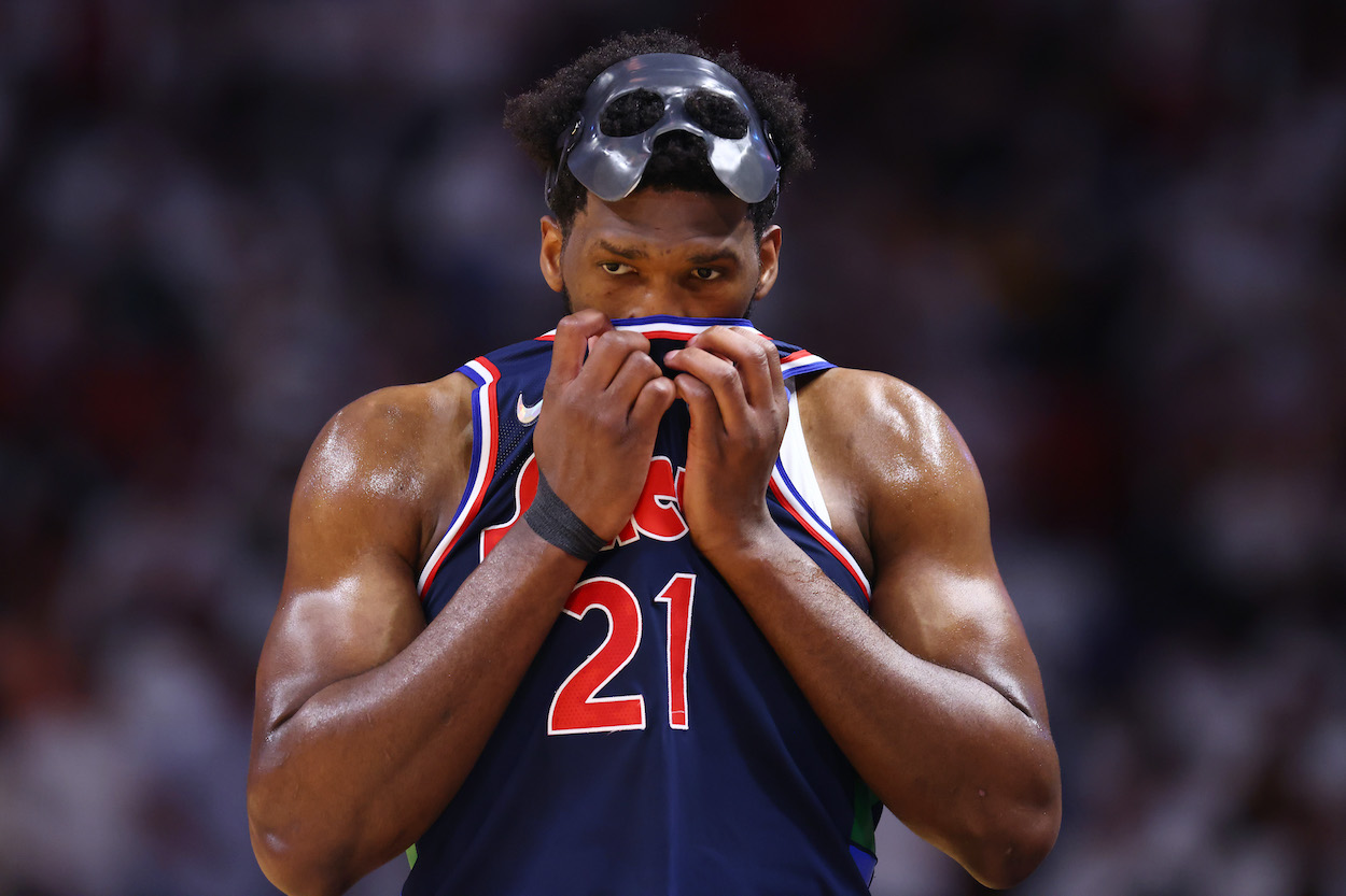 Joel Embiid rubs his face against the Heat.