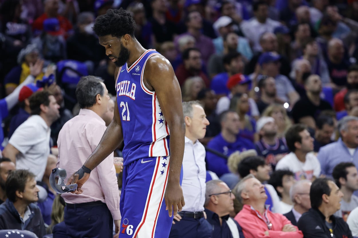 Joel Embiid walks off the court.