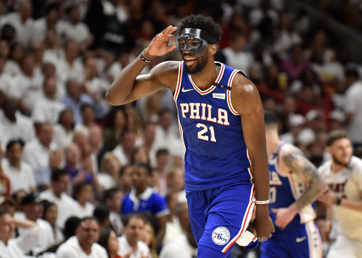 Joel Embiid wears a protective mask in 2018.