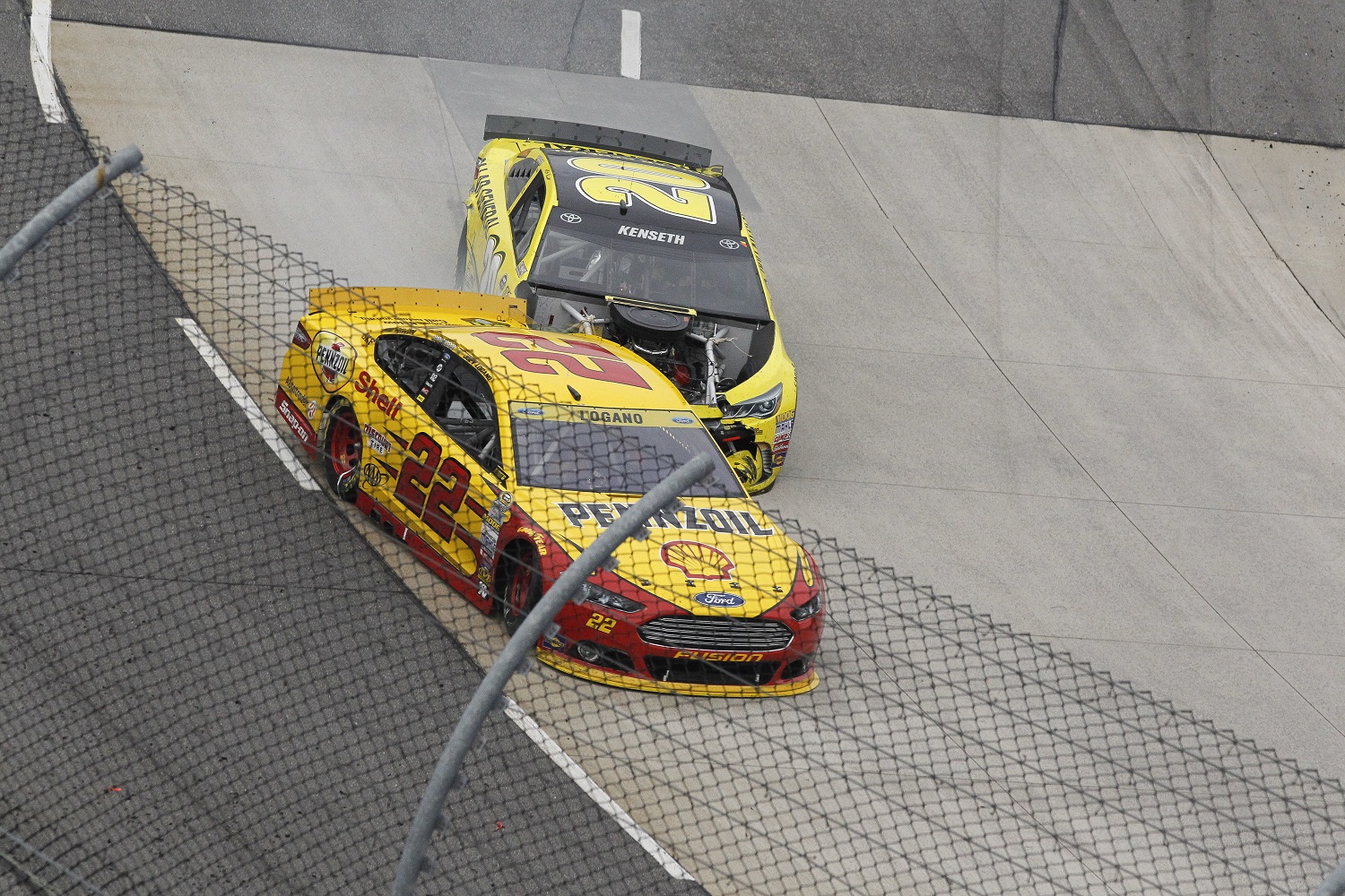 Matt Kenseth collides with Joey Logano and follows him into the wall, knocking the No. 22 Ford out of the NASCAR Cup Series Goody's Headache Relief Shot 500 at Martinsville Speedway on Nov. 1, 2015.